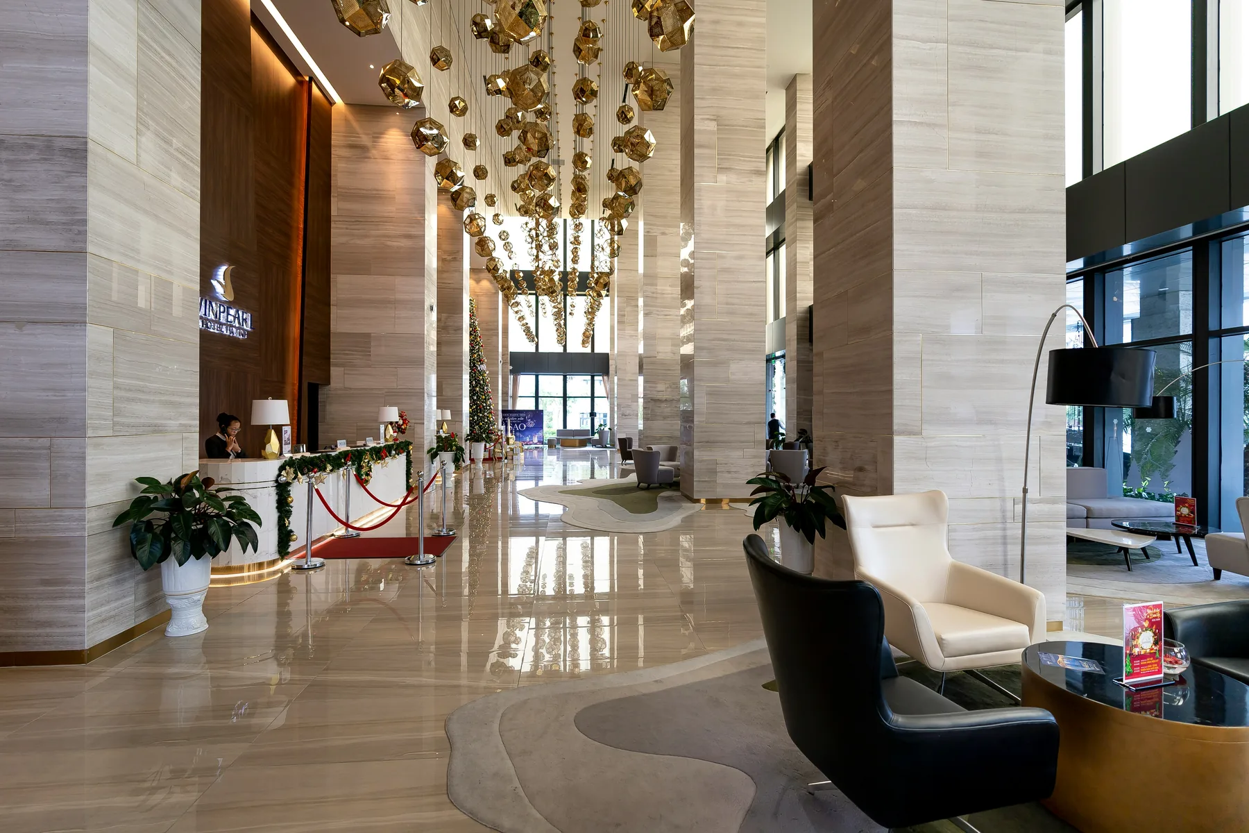 Illustrative hotel lobby interior with tall columns and seating